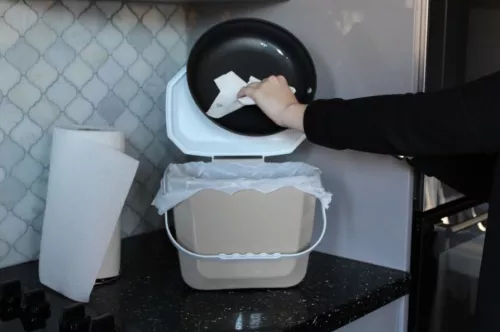 Wiping oil into trash