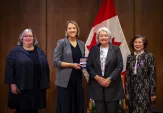 Pictured receiving the award are Janet Reid (Curator, Markham Museum), Rebekah Mitchell (Curator, YRDSB Museum & Archives), Her Excellency the Right Honourable Mary Simon (Governor General of Canada), and Nancy Siew (Founder, Tribute to Early Chinese Immigrants) at the official award ceremony in Winnipeg, Manitoba in November.